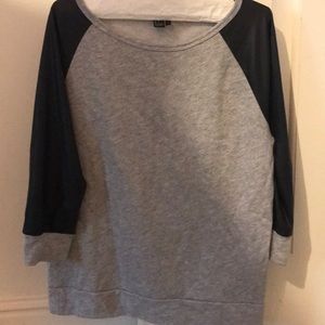 grey shirt with leather three fourths sleeves